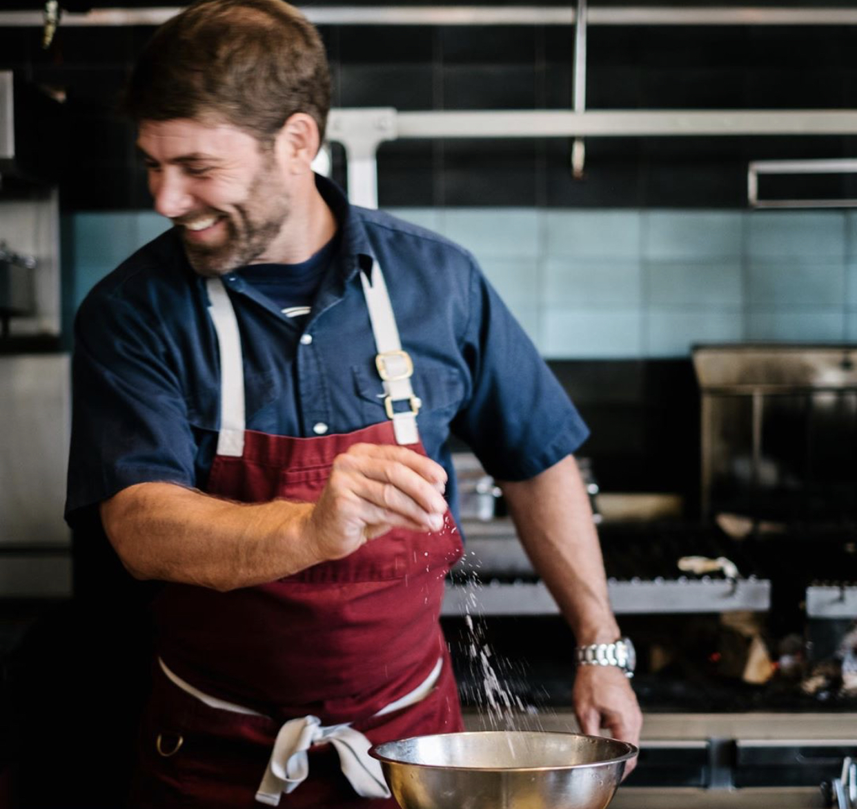 best restaurants west palm beach a man cooking in a kitchen preparing food