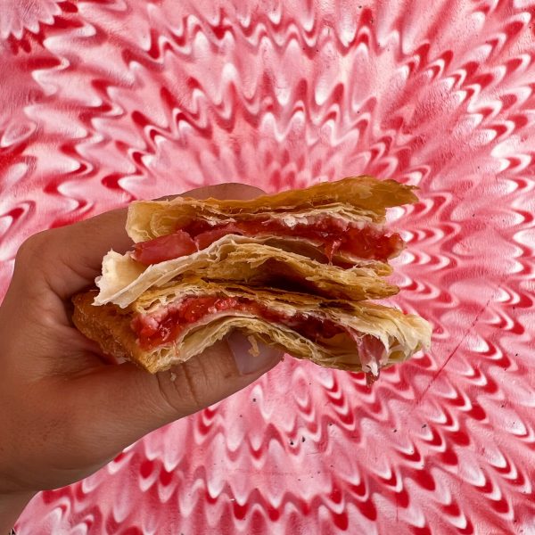 guava and cheese pastelito on a red and white background