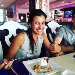 Woman smiling and giving a thumbs up to her dessert
