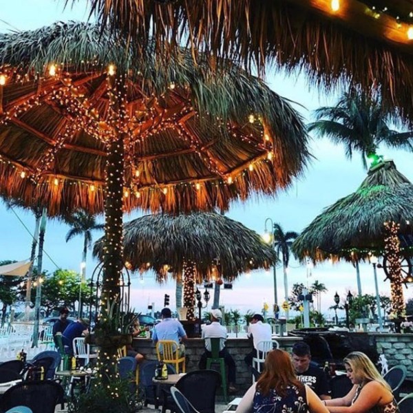 tiki huts with lights at night in west palm beach