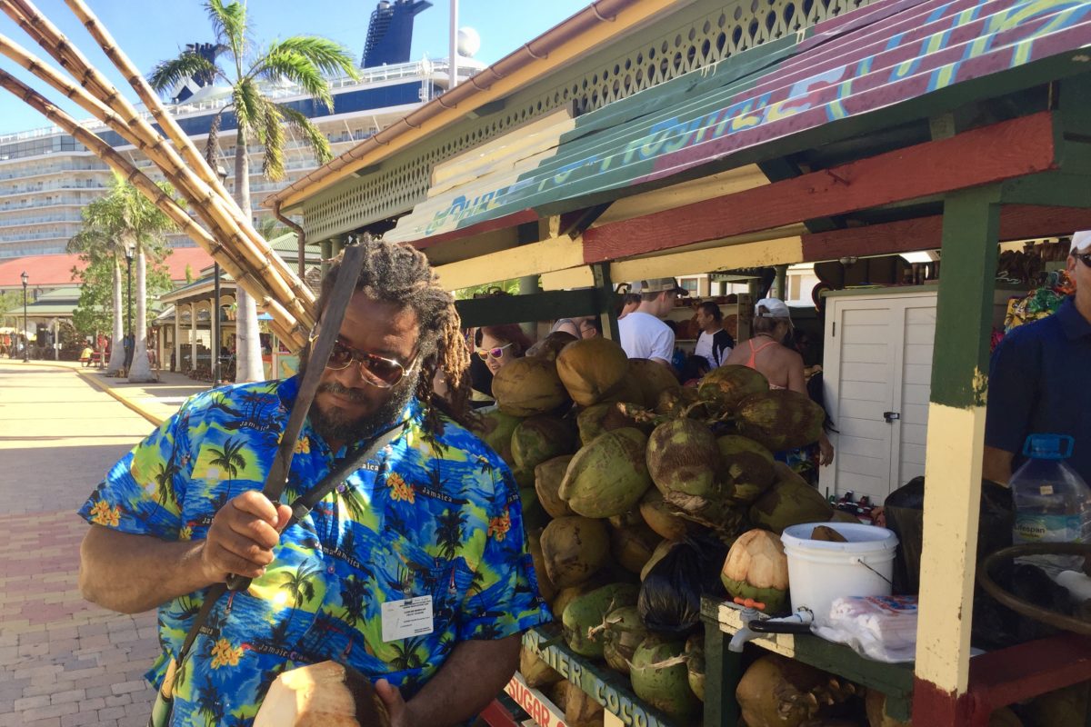 man cutting coconut