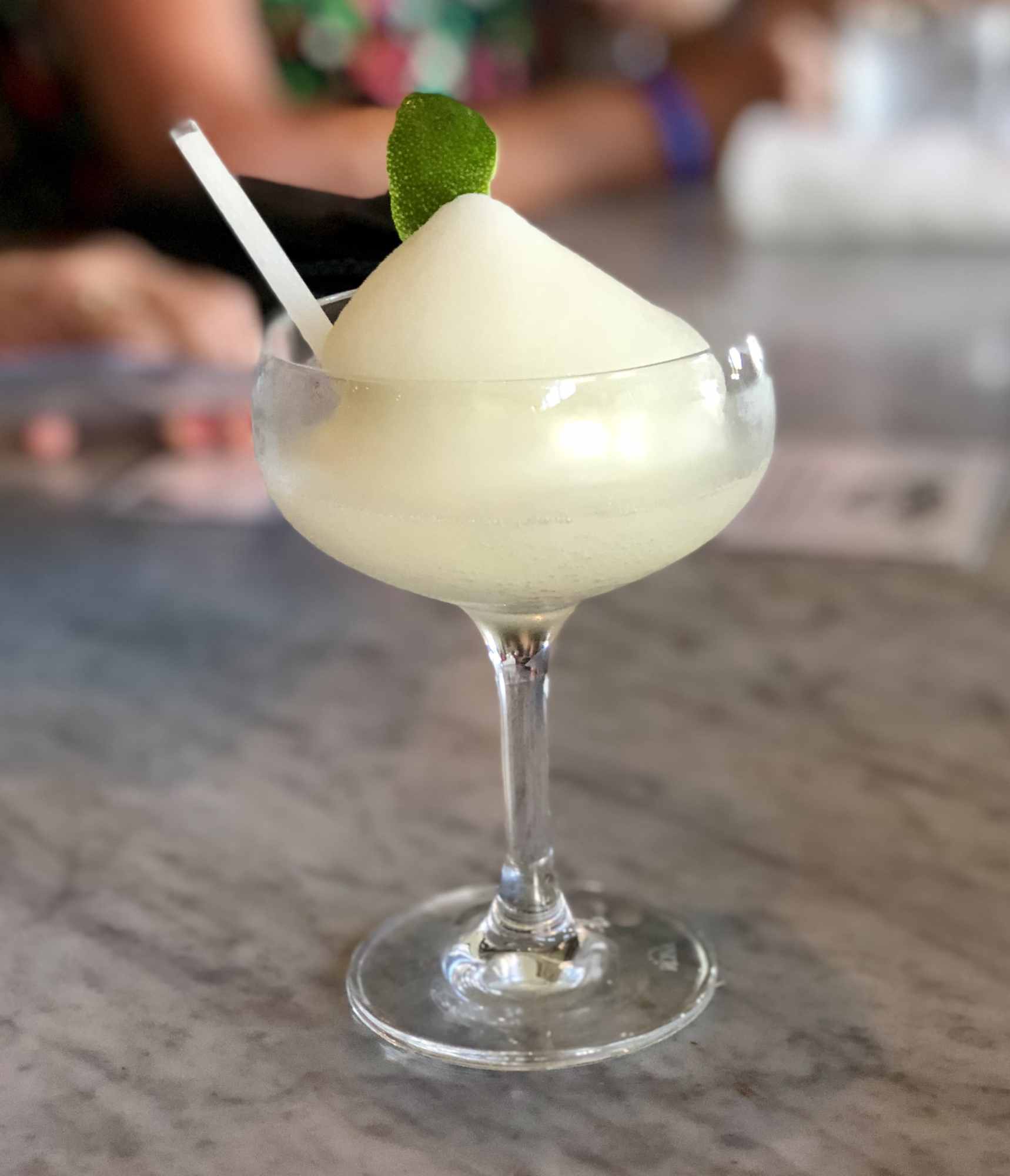 frozen Moscow mule with a lime twist and a straw