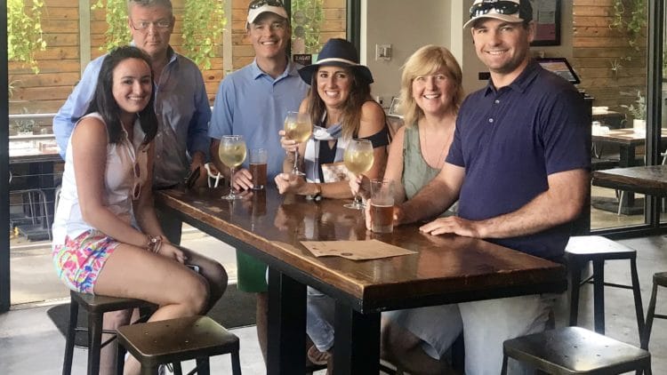 people gathered round table at a restaurant