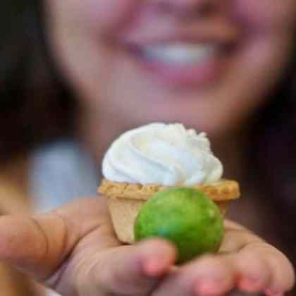 woman holding piece of food
