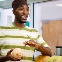 a man showing a coconut