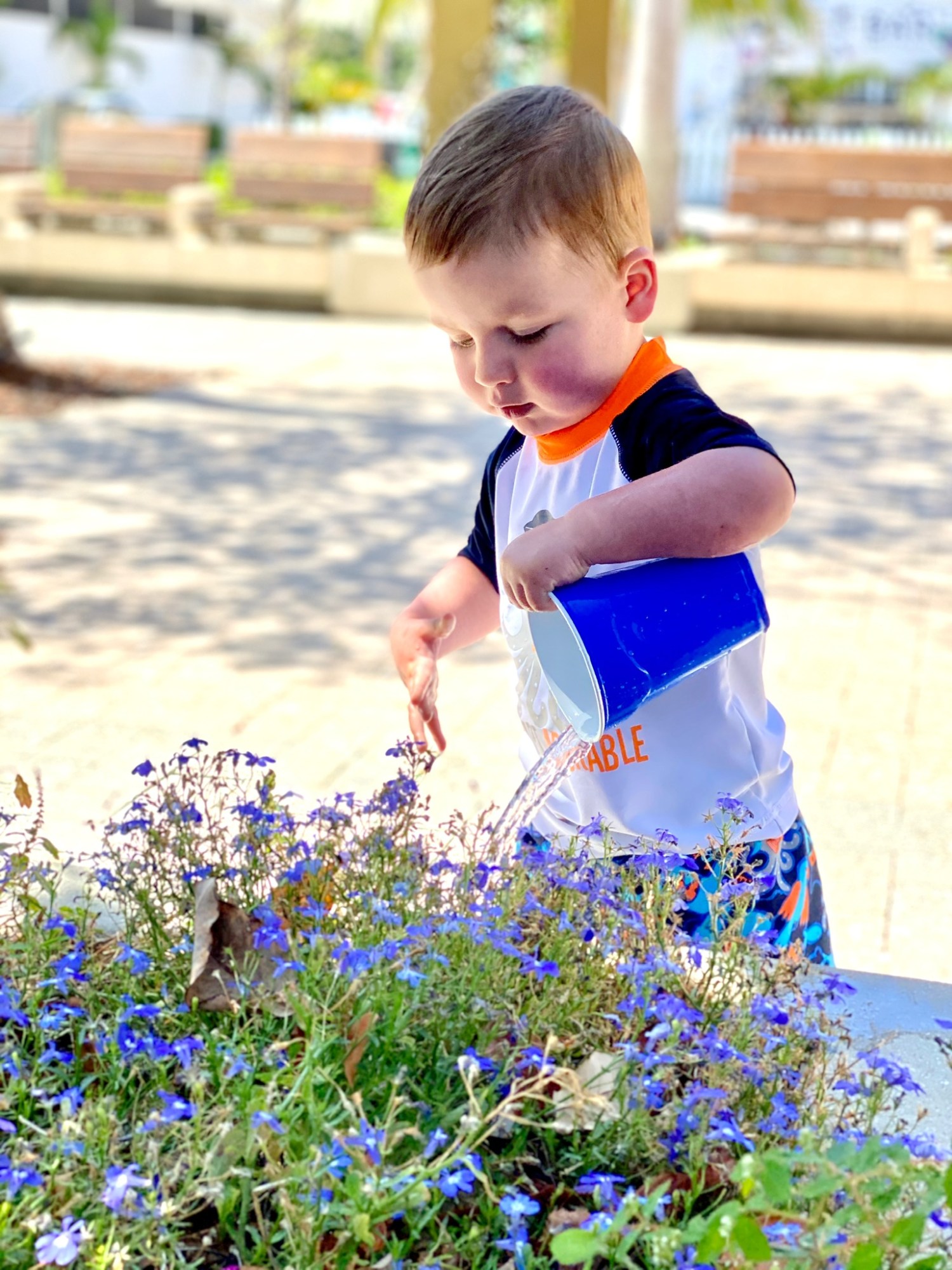 a young boy with a blue solo cup