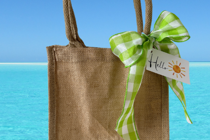jute bag with a lime green ribbon