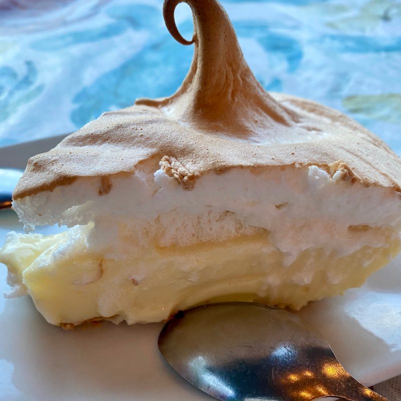 key lime pie slice on a plate with toasted meringue