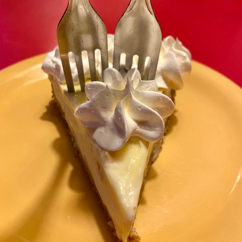 key lime pie with 2 forks in it