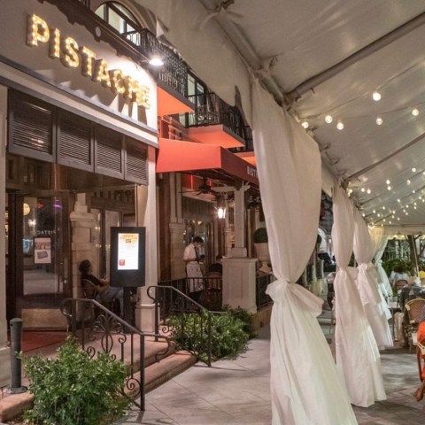 exterior of a restaurant in west palm beach at night with little white lights