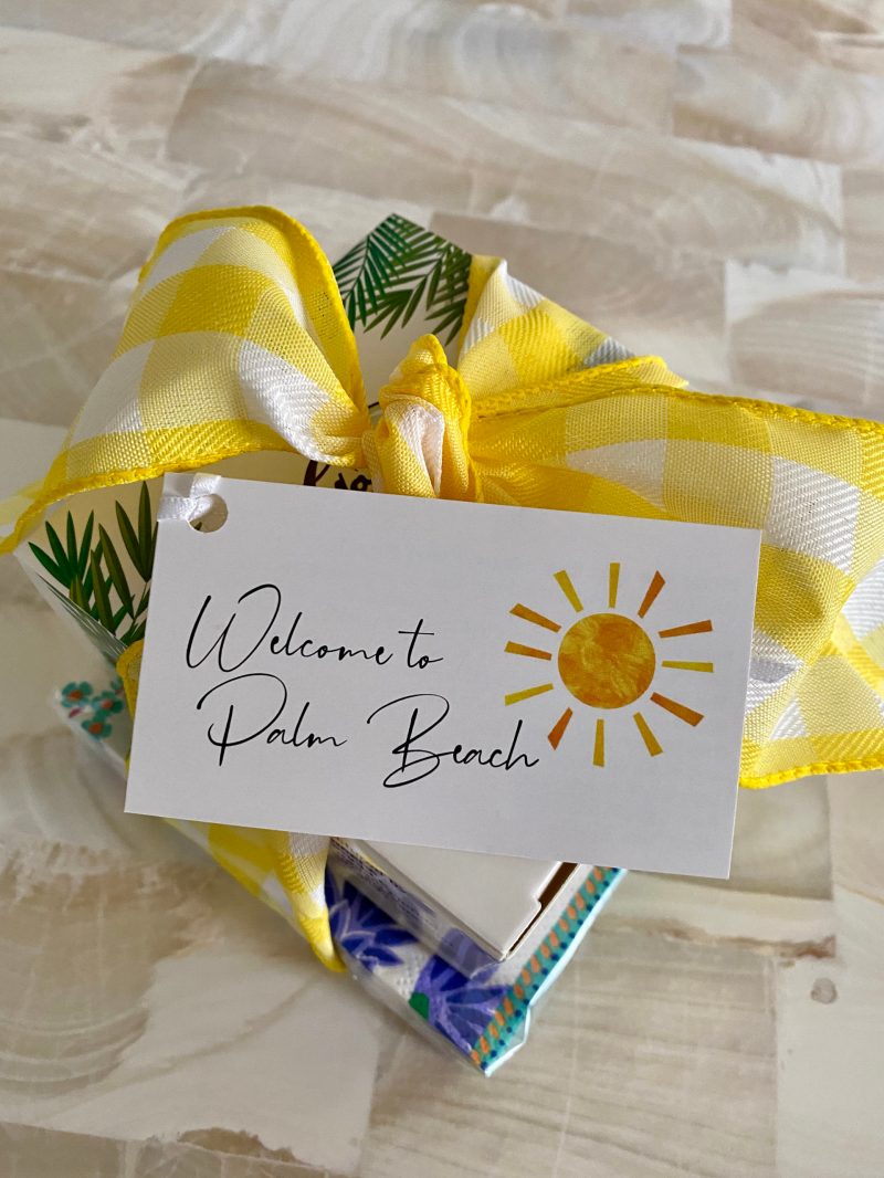 welcome to palm beach gift tag with a sun and a yellow bow