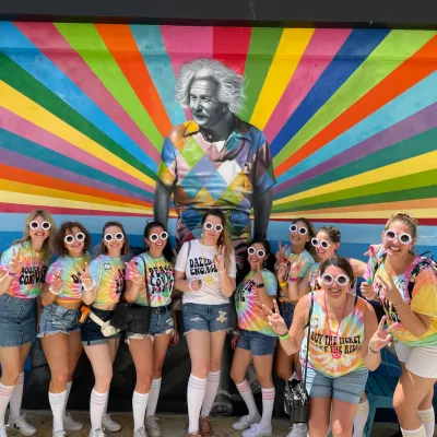 a group of girls in front of the colorful Einstein mural in west palm beach