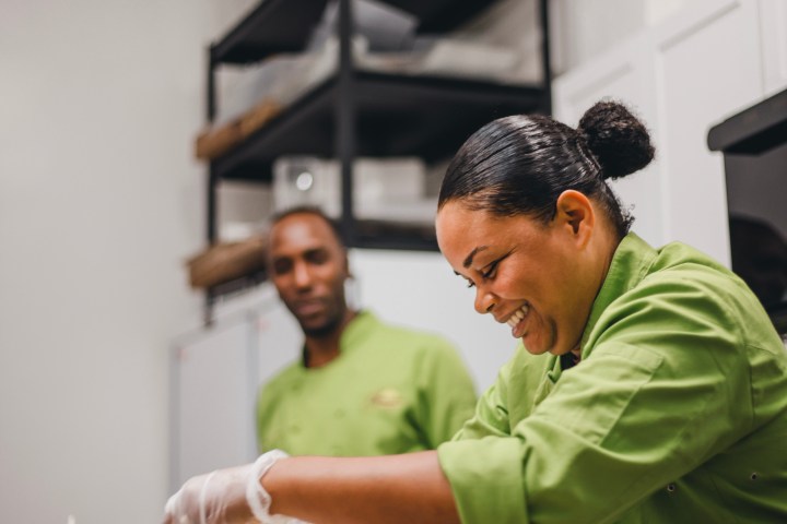 a person cooking in a kitchen preparing food