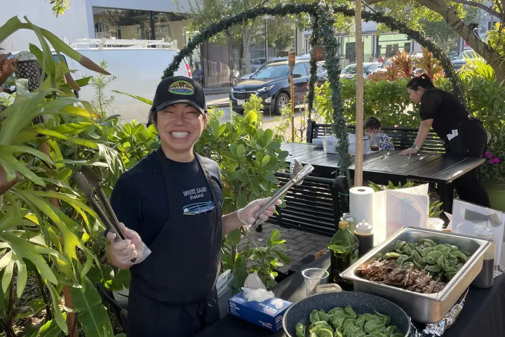 a person holding a plate of food